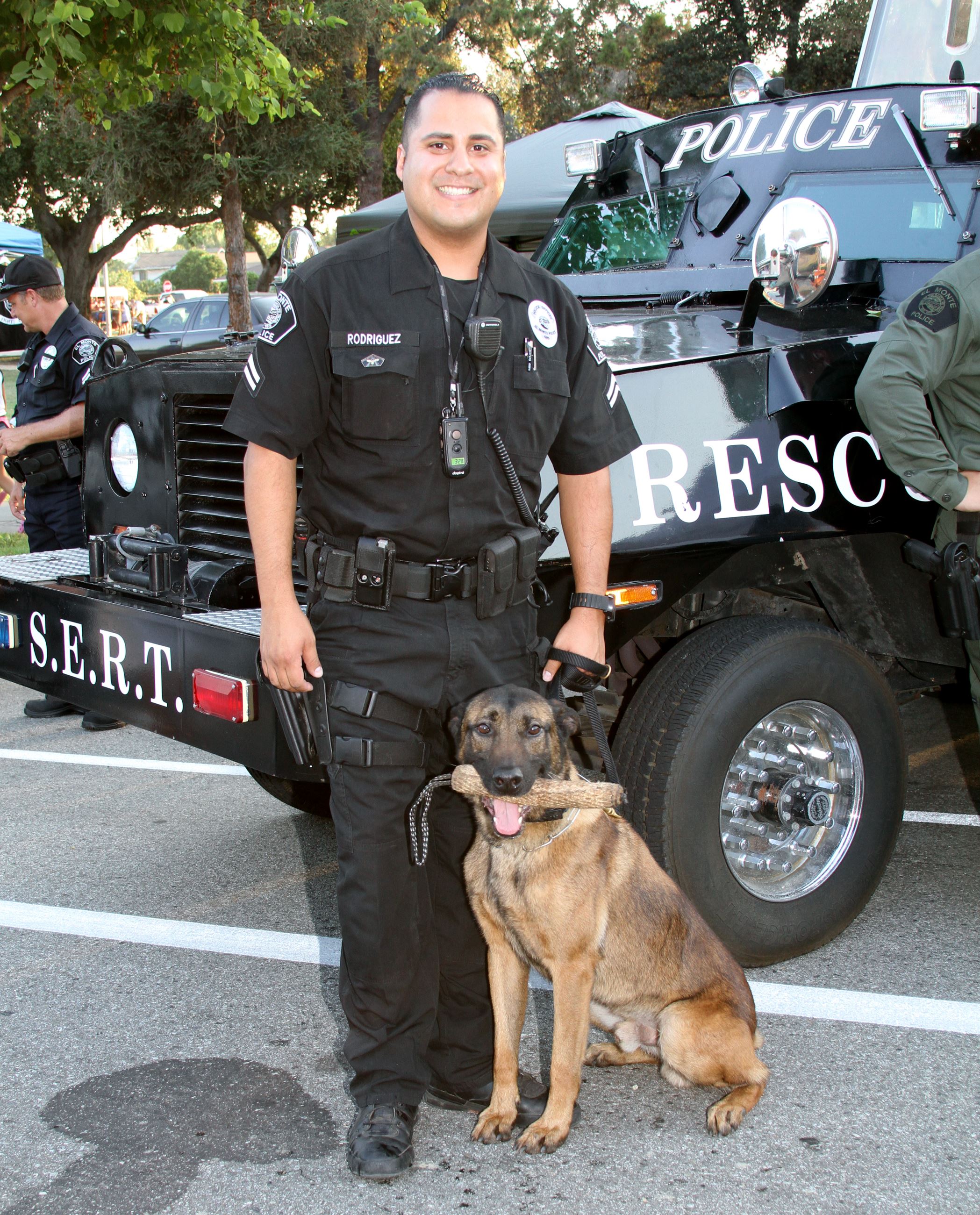 Officer Stands with Dog Officer from Canine Unit