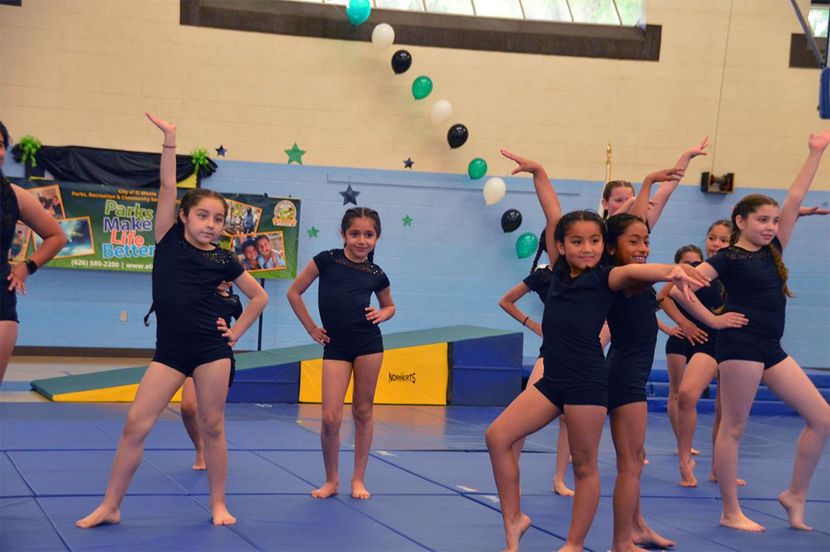 Girls posing during gymnastics class